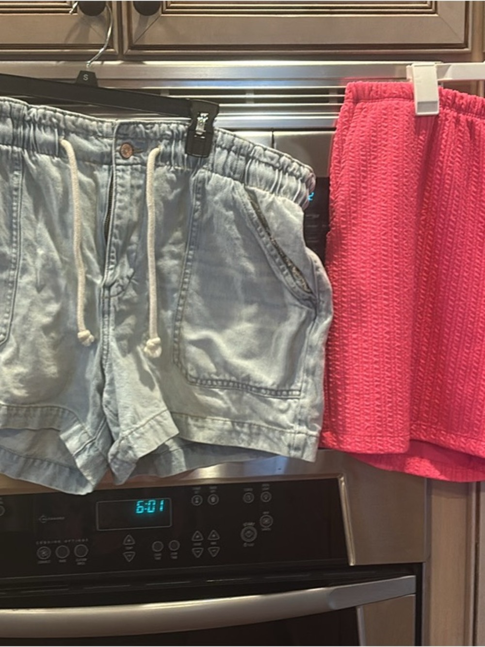 Maurices Light Wash Blue Denim Shorts with Pink Accent